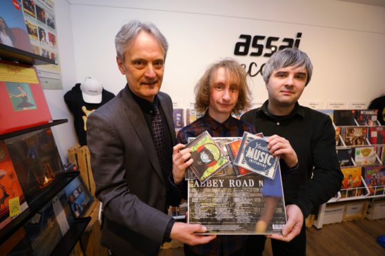 Marley Davidson, with Grant Ritchie, left, Principal of Dundee & Angus College, and Matthew Marra - Shop Manager, in Assai Records.