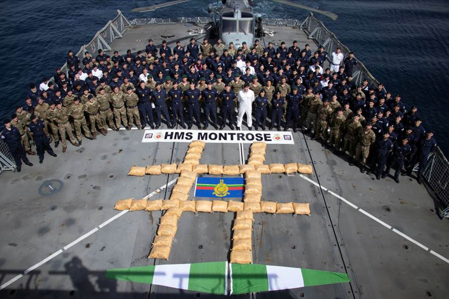 HMS Montrose crew with the massive haul of hashish.