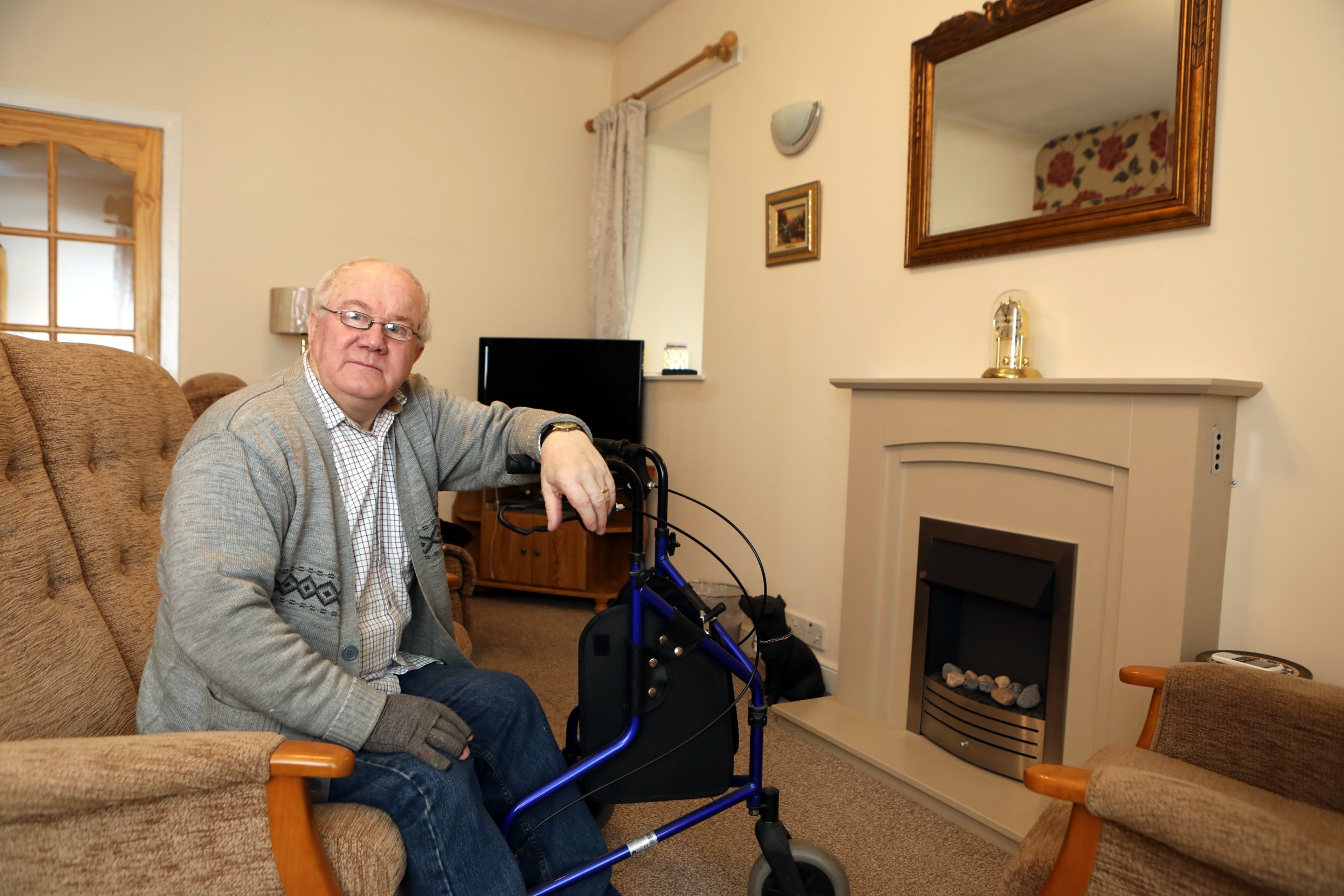 Jim Baker, 70, in the living room of his Carnoustie home.