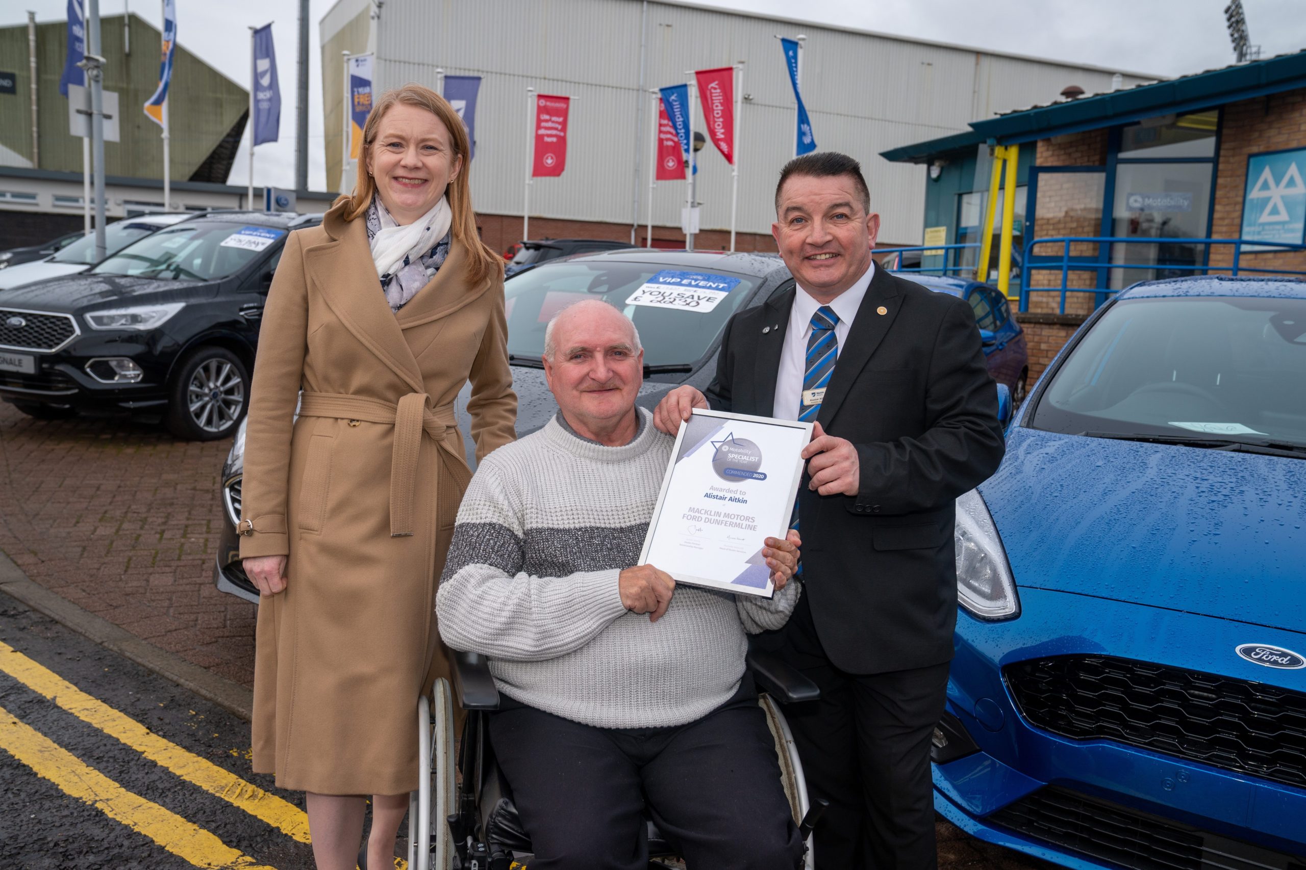Social Security Secretary Shirley-Anne Somerville with Kenneth Harper and Alastair Aitken, Motability specialist at Macklin Motors in Dunfermline.