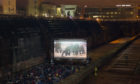 Cinema goers watch Stanley Kubrick's, 2001: A Space Odyssey, at Harland & Wolff Shipyard's, Titanic Dry Dock during the 2013 Belfast Film Festival.