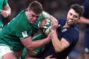 Adam Hastings fights for space with Tadhg Furlong during Saturday's game in Dublin.