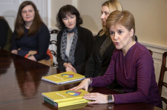 First Minister Nicola Sturgeon with care review representatives in the Cabinet Room at Bute House, Edinburgh, following the publication of the Independent Care Review report.