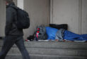 EMBARGOED TO 0001 SUNDAY NOVEMBER 26

File photo dated 07/02/17 of a person sleeping rough in a doorway. A cross-party group of MSPs has called for the Scottish Government to introduce a seven-day limit for homeless B&B use. PRESS ASSOCIATION Photo. Issue date: Monday November 26, 2018. A report by homelessness charity Crisis indicated that 84% of 74 people stuck living in B&Bs, hotels or unsupported hostels felt isolated by their living situation. See PA story SCOTLAND Homelessness. Photo credit should read: Yui Mok/PA Wire