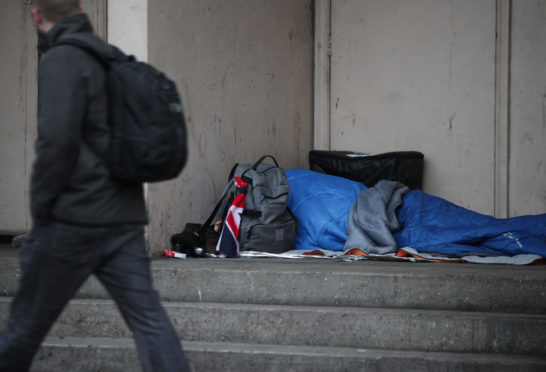 EMBARGOED TO 0001 SUNDAY NOVEMBER 26

File photo dated 07/02/17 of a person sleeping rough in a doorway. A cross-party group of MSPs has called for the Scottish Government to introduce a seven-day limit for homeless B&B use. PRESS ASSOCIATION Photo. Issue date: Monday November 26, 2018. A report by homelessness charity Crisis indicated that 84% of 74 people stuck living in B&Bs, hotels or unsupported hostels felt isolated by their living situation. See PA story SCOTLAND Homelessness. Photo credit should read: Yui Mok/PA Wire