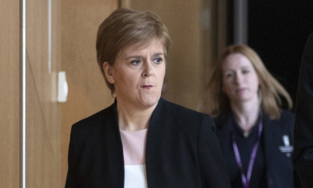 A tense-looking Nicola Sturgeon arriving to give her statement on Derek Mackay ahead of FMQs.