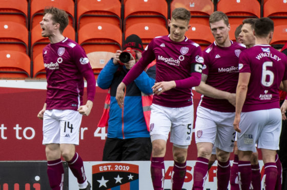 Craig Wighton, left, celebrates after scoring only goal of the game.