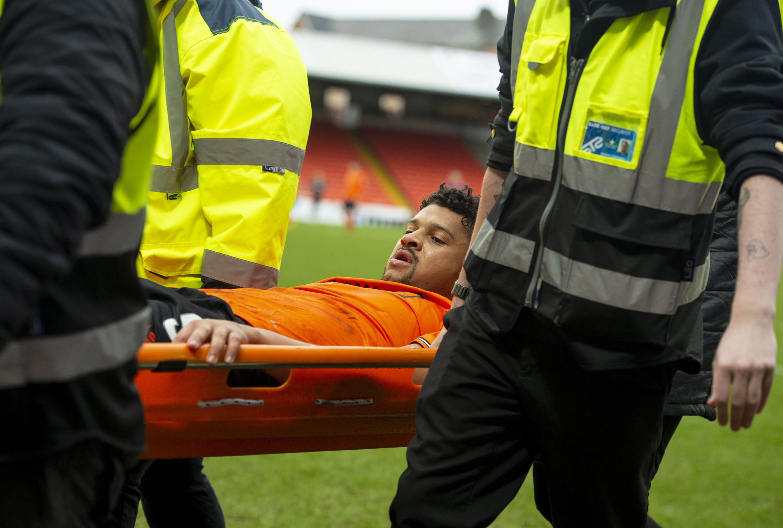 Osman Sow is carried off at Tannadice.