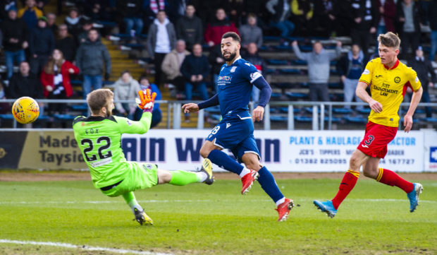 Kane Hemmings scores Dundee's second goal.