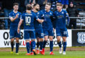 Dundee's Kane Hemmings celebrates after scoring against Partick Thistle in February