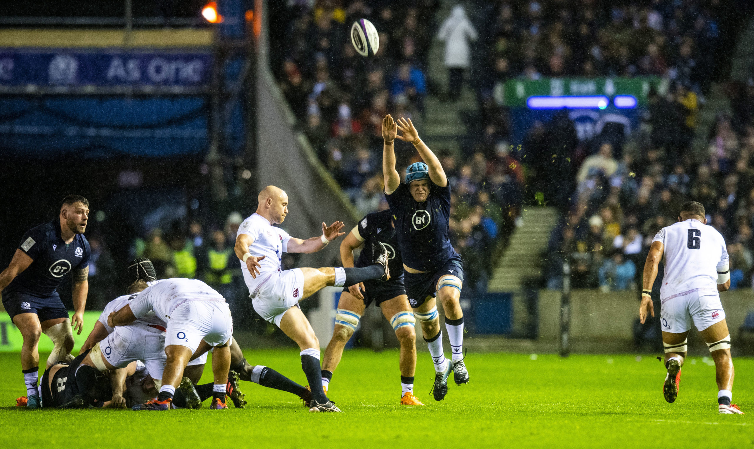 Scotland's Scott Cummings charges down Willie Heinz's attempted kick.