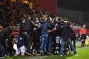 The Raith Rovers fans invade the pitch after Regan Hendry's goal during the 2-1 semi-final win at Firhill.