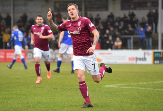 David Gold celebrates his goal against Queen of the South.