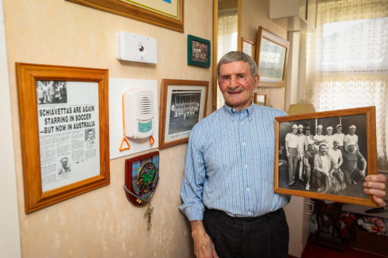 Peter Schiavetta (84) with family photographs relating to the Ben Attow fishing disaster.