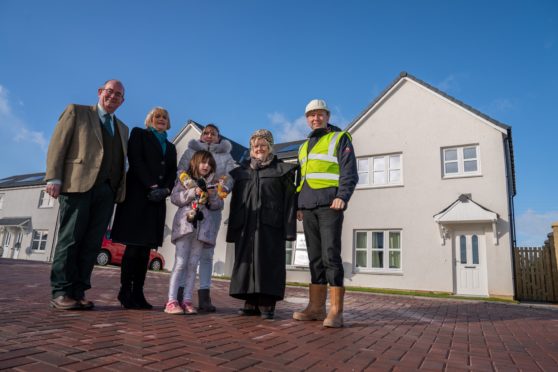 Councillor Bob Brawn, Alastair White (Managing Director Muir Homes), Local Tenant Veronica Robb and her 9 year old daughter Eve, Councillor Anne Jarvis and Barbara Renton. Picture: Kenny Smith.