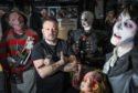 Owner Will Robertson in his Sweeney Todd barber shop with some of his collection.