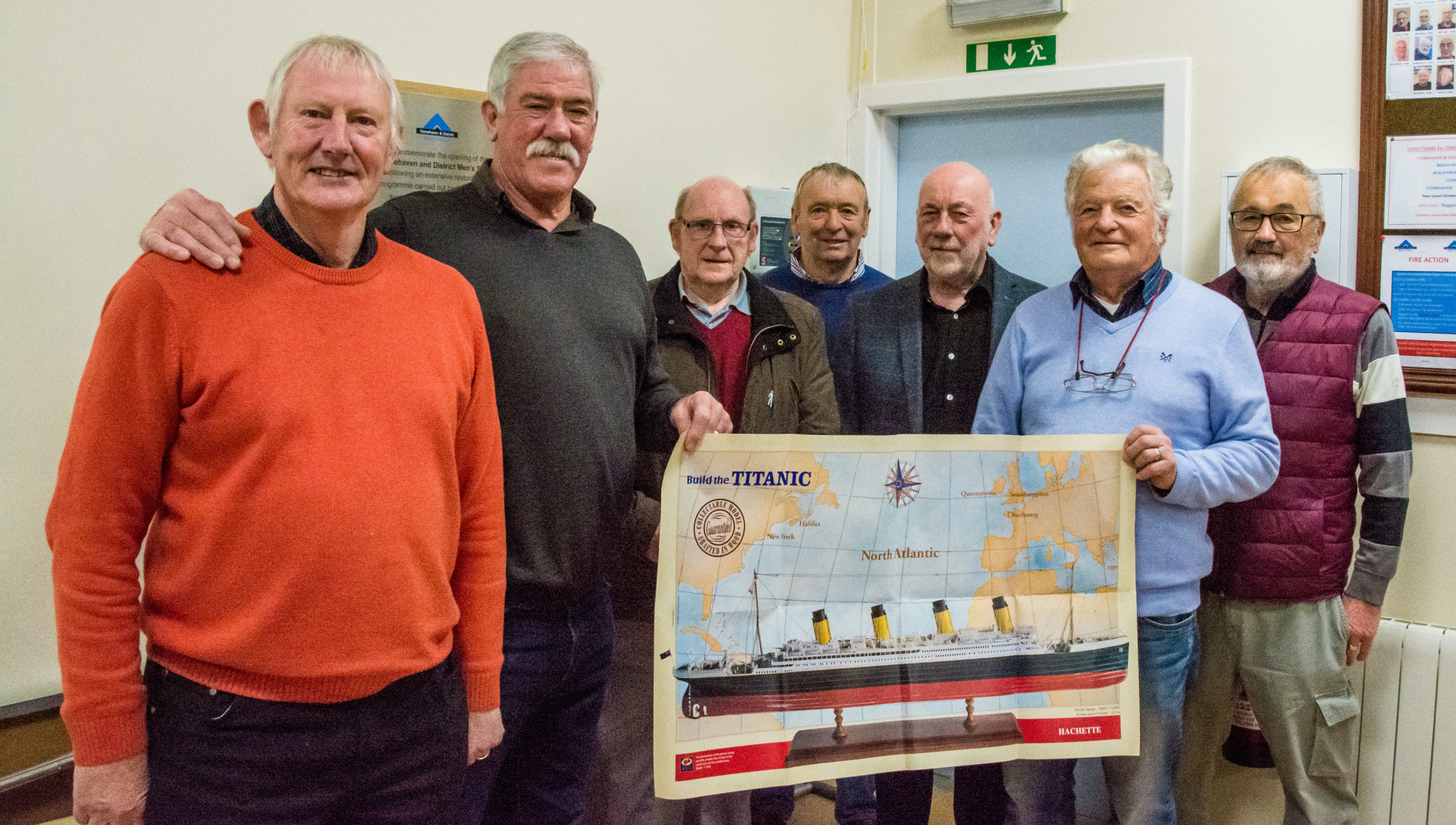 Allan Hay donor of the Titanic kit, middle, Billy Allan Chair, Stonehaven Men's Shed, right, Dave Ramsay, Mearns Heritage Services, along with Men's shed members who will be working on the project.