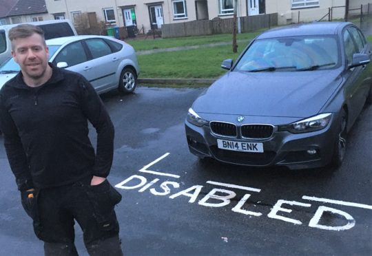 Ballingry resident Wullie Campbell and the disabled bay painted around his car while he was at work.