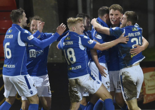 Saints celebrate their winner.