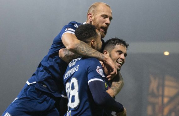 Declan McDaid celebrates a goal with Kane Hemmings.