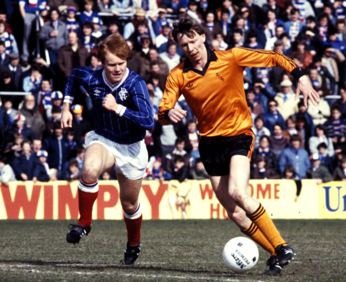United's Davie Dodds beats Rangers' Dave MacKinnon in 1982.