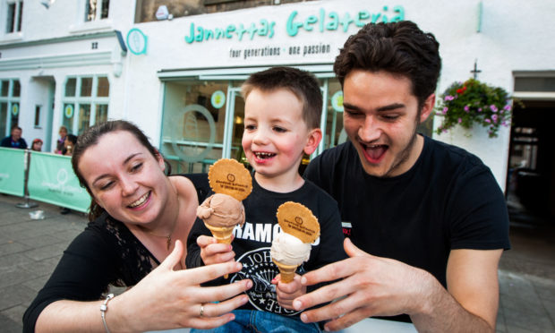 Luke Latto enjoying two ice creams with Beth McConnochie and Mark Edwards at Jannettas Gelateria.