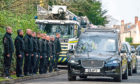 A guard of honour at the funeral of former firefighter Ian Wishart from Kirkcaldy.