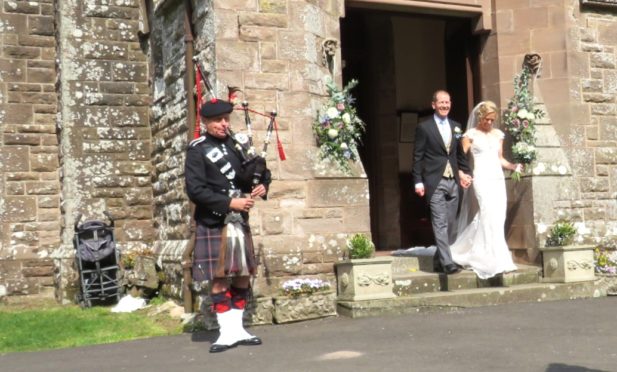 Mark Lumgair playing at a wedding