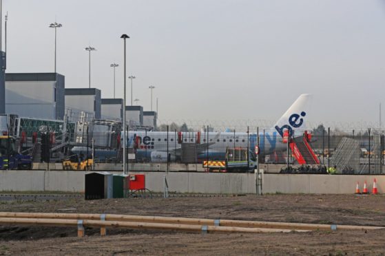 A Flybe plane parked up at Manchester Airport, as Flybe, Europe's biggest regional airline, has collapsed into administration. PA Photo. Picture date: Thursday March 5, 2020. See PA story AIR FlyBe. Photo credit should read: Peter Byrne/PA Wire