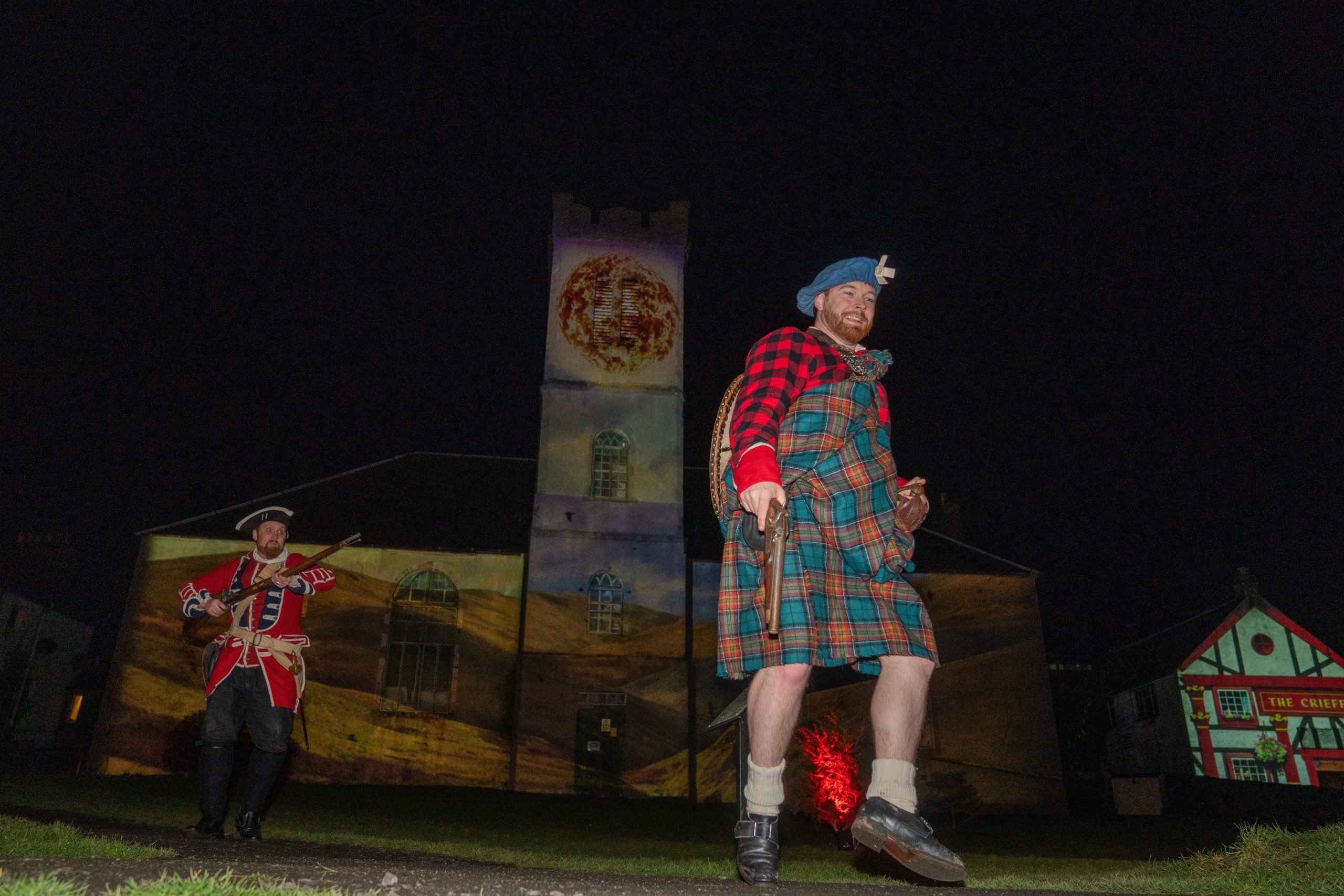 Rob Roy McGregor ( Nick Inees) is chased by a Red Coat (Daryll Wrighy) during the Fire & Folklore, Heroes & Villains festival