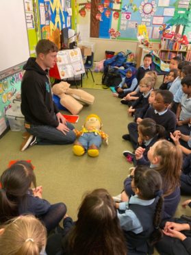 Sean Duffy, from First Stop Safety Training, teaching school children first aid.