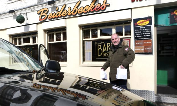 Michael Starchan heads out to deliver meals, wednesday 18th march.