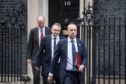 Health Secretary Matt Hancock (right), and Chief Medical Officer Chris Whitty (left) leaving the Cabinet Office in London, after a meeting of the Government's emergency committee Cobra to discuss coronavirus.