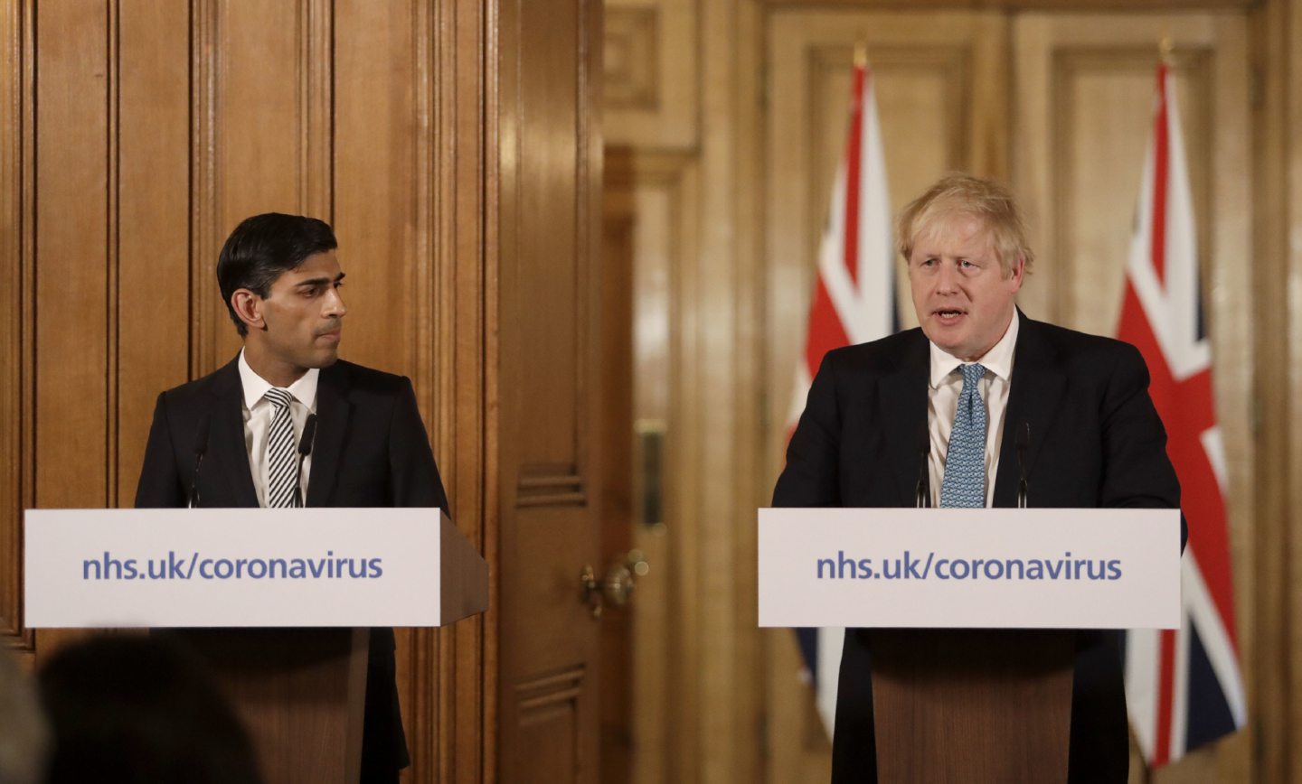 Prime Minister Boris Johnson, with Chancellor Rishi Sunak, speaking at a media briefing in Downing Street, London, on Coronavirus.