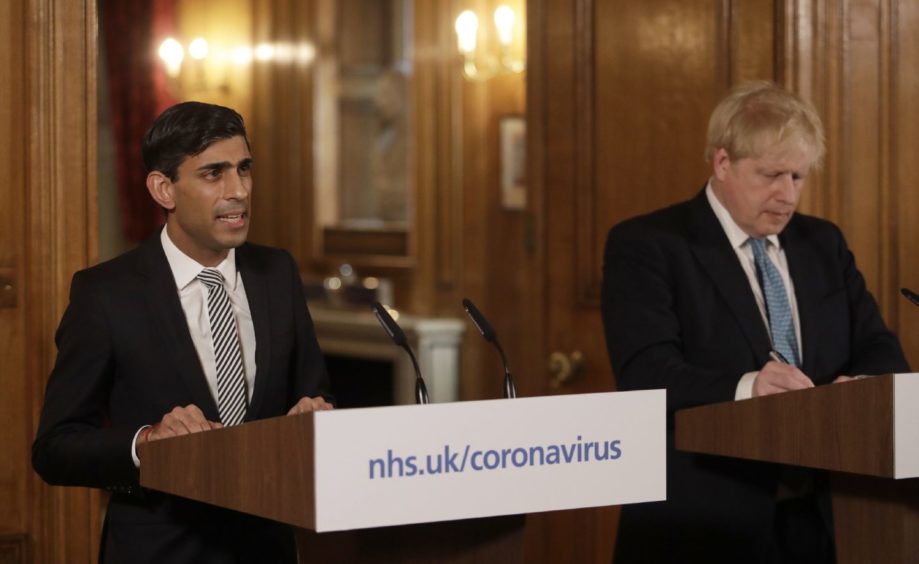 Chancellor Rishi Sunak with Prime Minister Boris Johnson at a media briefing in Downing Street.