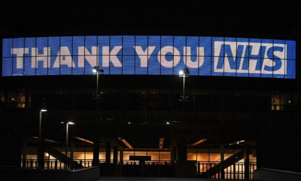 Wembley Arch is illuminated in blue to show its appreciation to the NHS amid the coronavirus outbreak in London.