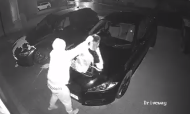 VIDEO: Brazen vandal caught on CCTV pouring paint over cars in Kelty