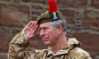 The Prince of Wales salutes soldiers at Fort George in 2016.