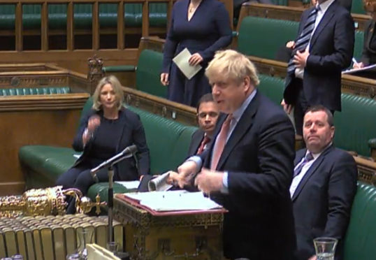 Boris Johnson speaks during Prime Minister's Questions in the House of Commons.