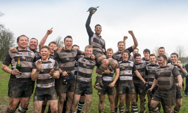 Adam, being held aloft, was greatly respected and revered by his teammates.