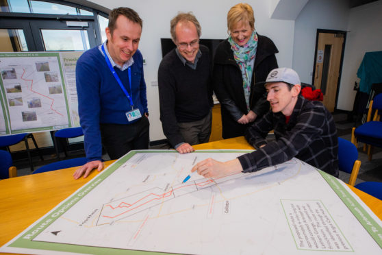 Scott Dryden, Angus Council traffic engineer, Countryside officer Paul Clark and Councillor Brenda Durno with Scott Francis of Angus Cycle Hub (seated) at the FriockHub event.