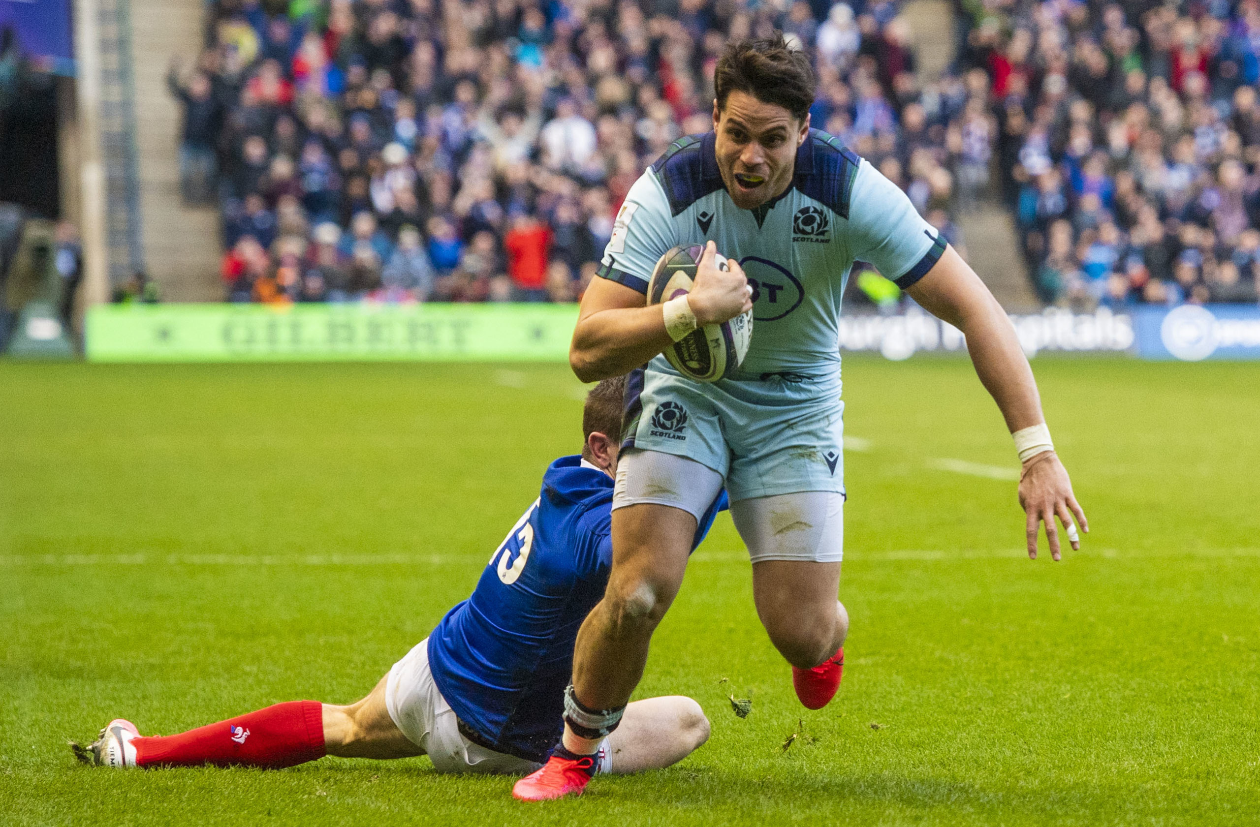 Sean Maitland evades France's Anthony Bouthier to score his and Scotland's second try against France in March.