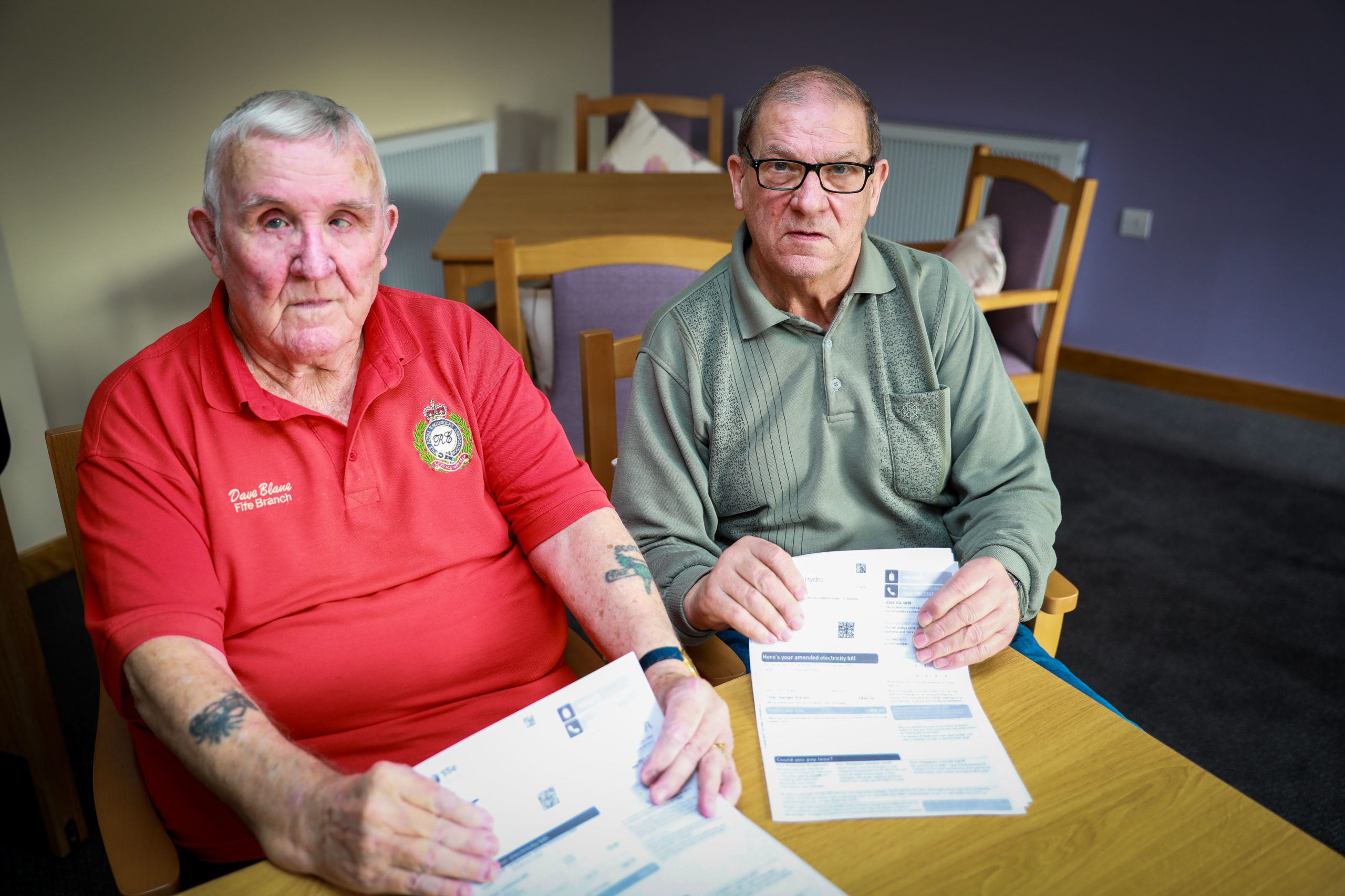 Dave Blane, 79,and Drew Barnes, 73,  with their Den Court utility bills.