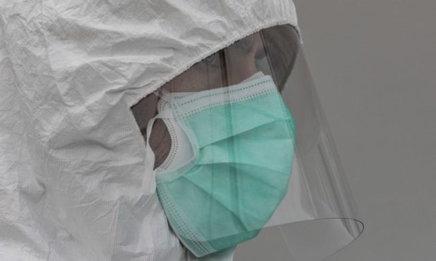 A healthcare worker wears protective gear during the coronavirus outbreak.