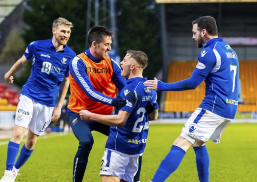 Drey Wright joins in the Callum Hendry goal celebrations.