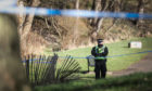 Police have cordoned off a section of the park around the Dighty Burn.