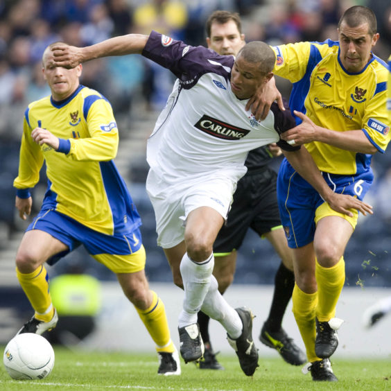 McManus tussles with ex-Rangers striker Daniel Cousin