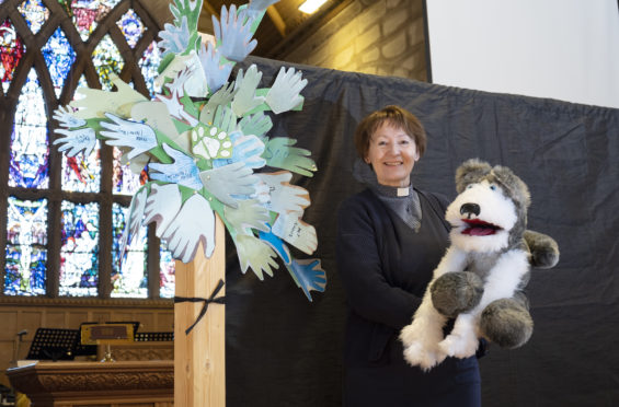 Rev Dr Karen Fenwick with 'Blizz' one of the Lowson puppet family used for fun with the children at virtual Sunday school.
