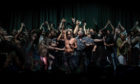 NO REUSE When audience members were invited on stage to dance at an Iggy Pop concert in Sydney Opera House, Australia, on 17 April 2019, it showed the warm welcome Aussies extend to overseas artists who travel long distances to reach them.       

A woman’s outstretched arm lunges to touch Iggy. He seems unaware of her approach as the crowd presses around him. One of Iggy’s assistants, Jos (in the grey checked shirt) tries to make some space around Iggy. The scene is reminiscent of a passage from the Bible: ‘Because she thought, “If I just touch his clothes, I will be healed.”’ (Mark 5:25-34, line 28). The image has been likened to religious paintings by Caravaggio, and his chiaroscuro technique. It went crazy on social media, making 40,000 people, including Iggy Pop, very happy.