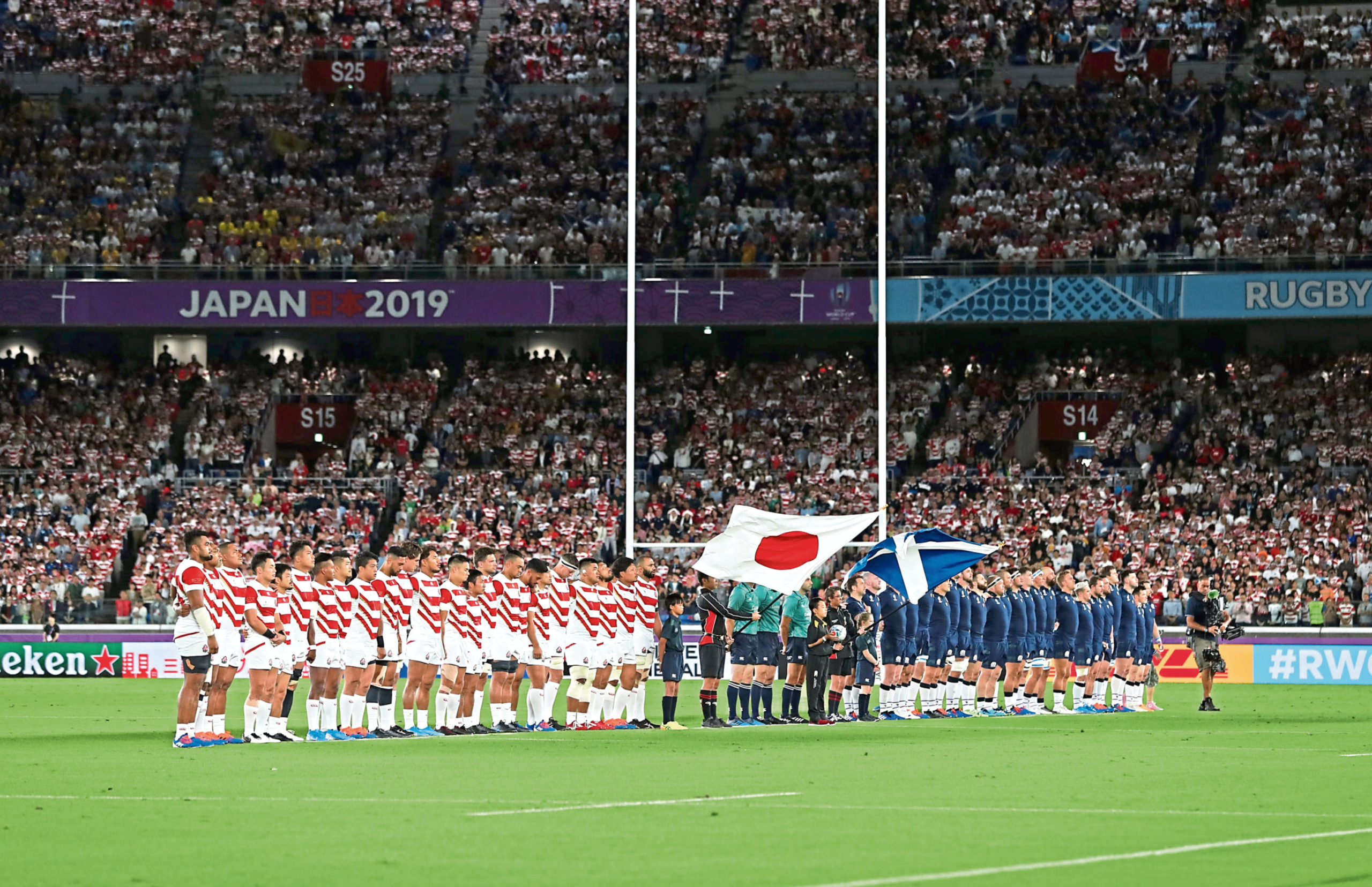 Japan and Scotland observe a minutes silence for the victims of Typhoon Hagibis during the 2019 Rugby World Cup match at the Yokohama Stadium, Yokohama. PA Photo. Picture date: Sunday October 13, 2019. See PA story RUGBYU Scotland. Photo credit should read: David Davies/PA Wire. RESTRICTIONS: Editorial use only. Strictly no commercial use or association. Still image use only. Use implies acceptance of RWC 2019 T&Cs (in particular Section 5 of RWC 2019 T&Cs) at URL: bit.ly/2knOId6